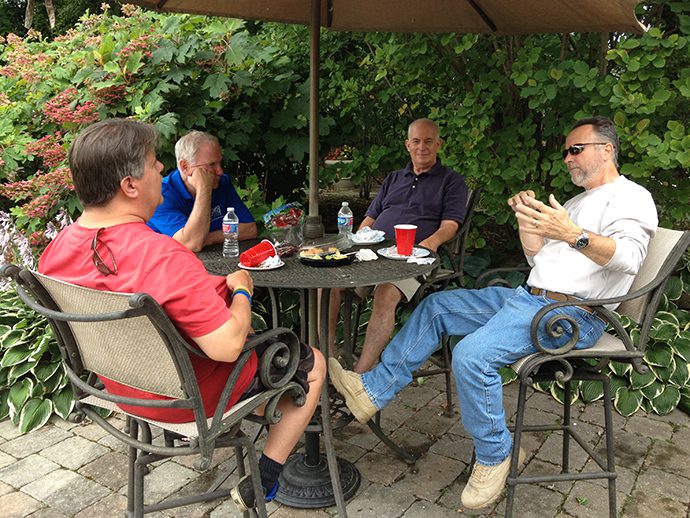 men-at-table Men talking at table